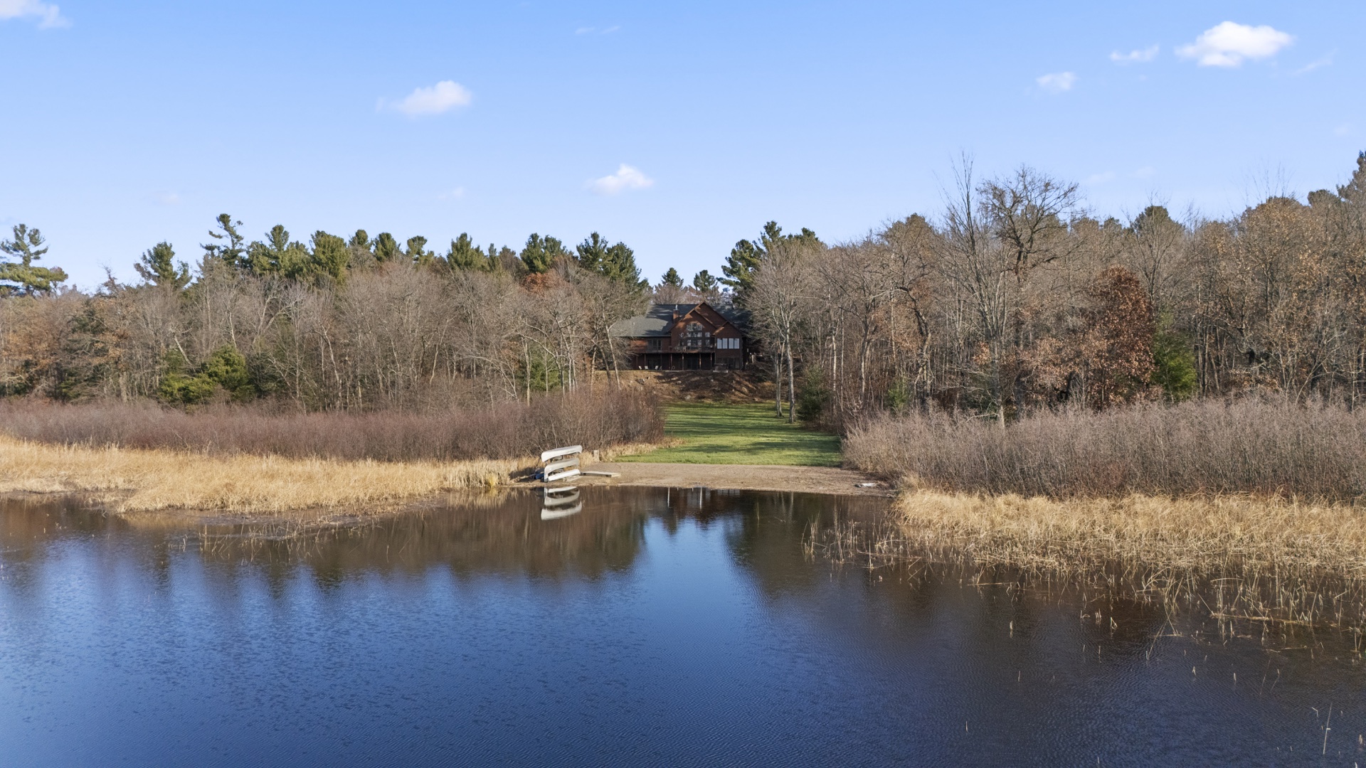 Aerial view of Long Lake Lodge with private dock and pristine lakefront access