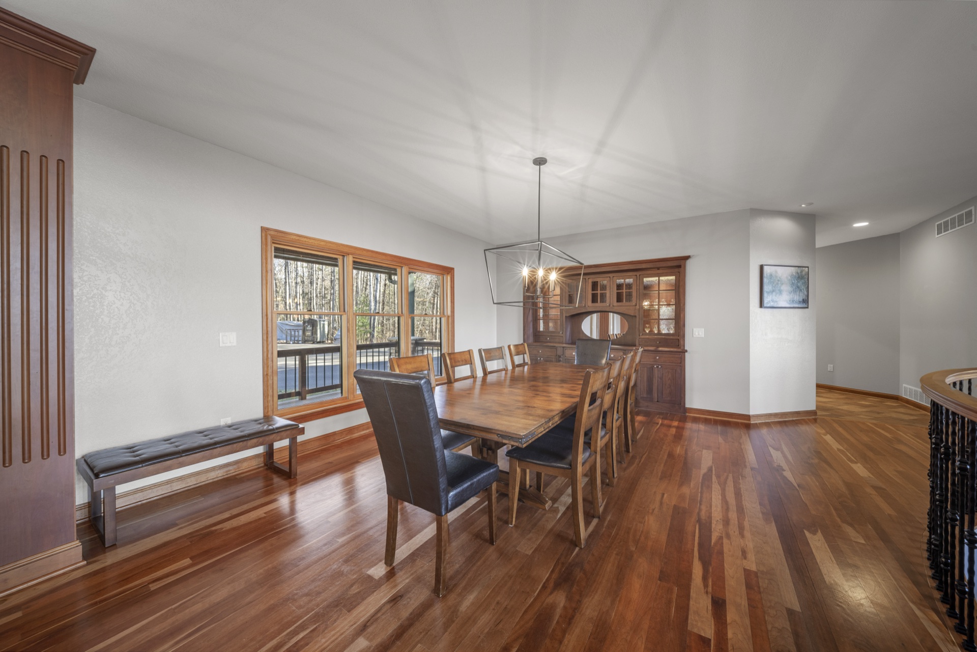 Dining area with custom woodwork and elegant lighting