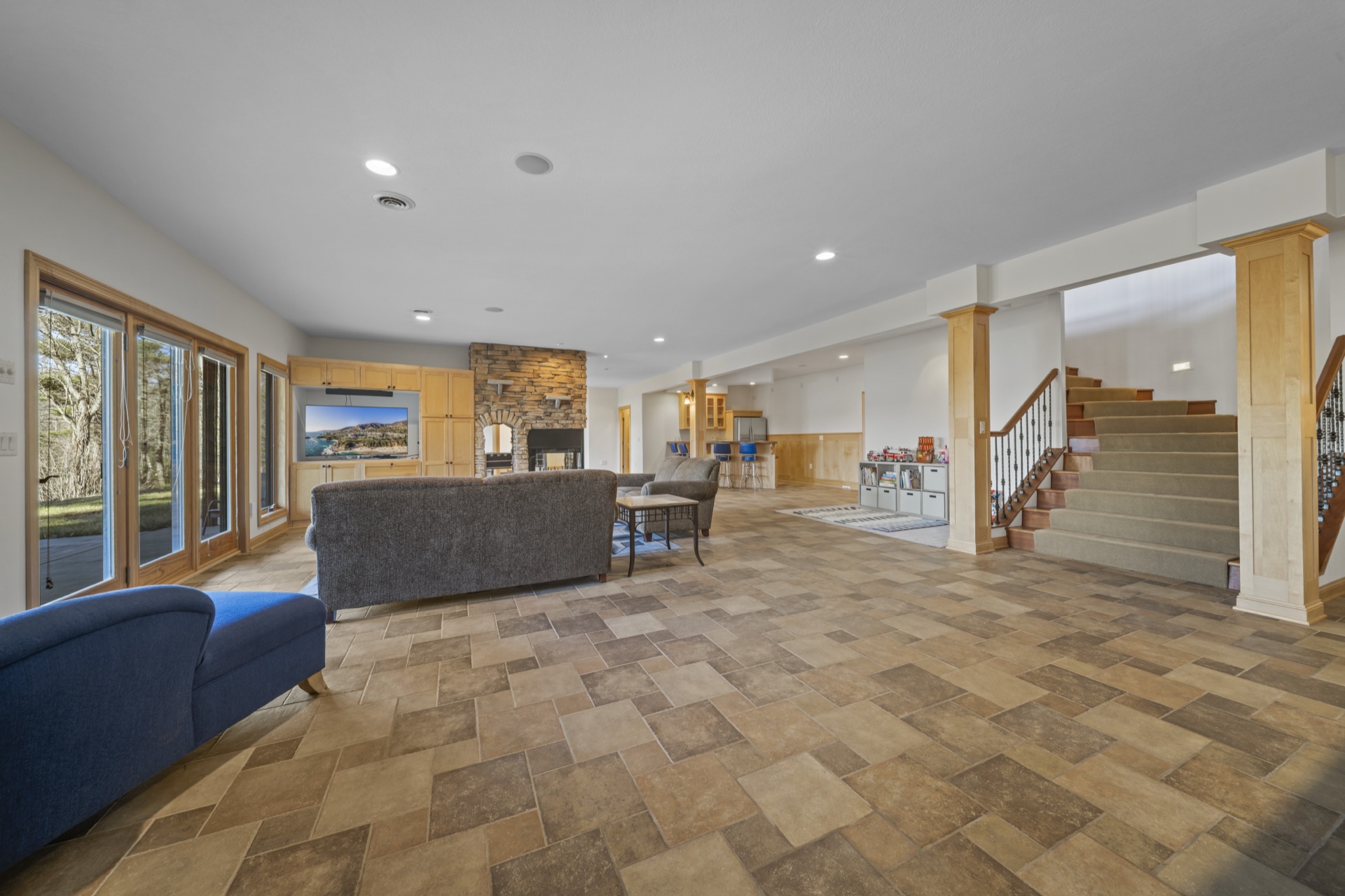 Stone fireplace in recreation room at Long Lake Lodge