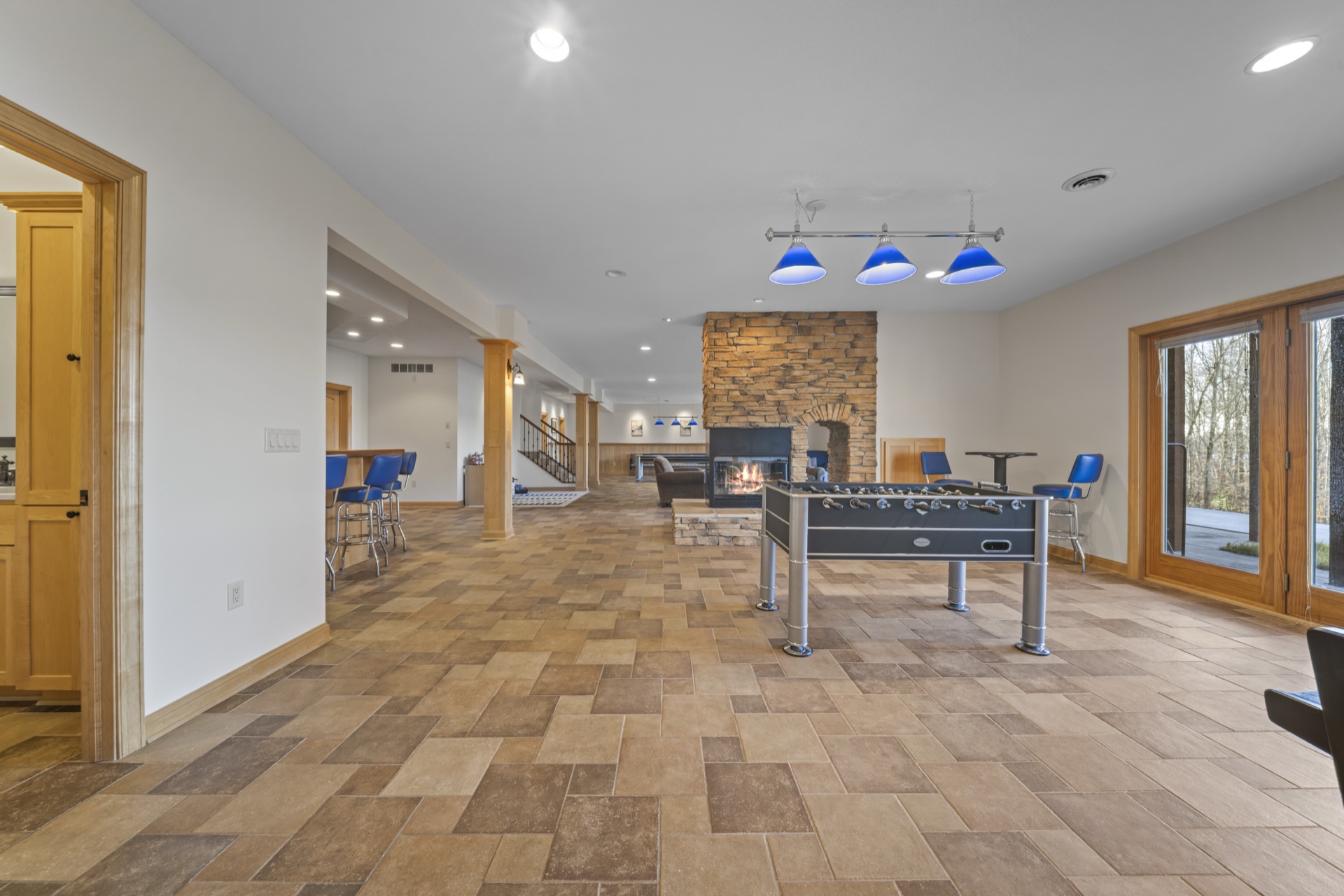 Overview of spacious recreation room with entertainment options